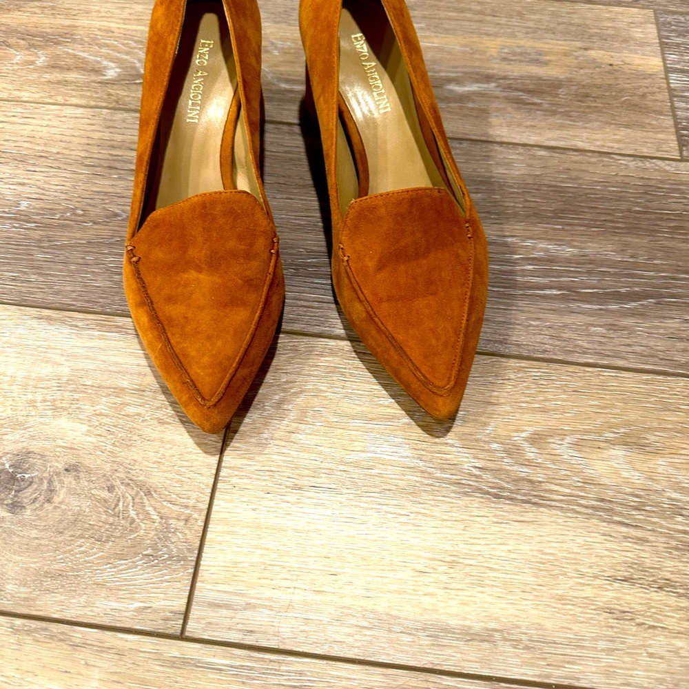 Cognac pointed-toe loafers with 1 inch heel.  Gold detail on heel.